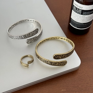 Retro bronze embossed floral open bangle and ring set with intricate relief patterns