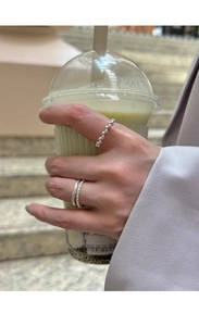 Close-up of minimalist S925 sterling silver beaded and double-layered rings set
