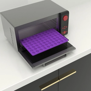 Purple silicone mold for Halloween candy and biscuits placed inside a modern oven