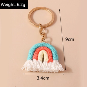 Detail of handmade knit rainbow keychain with tassels and dimensions showing 9cm height