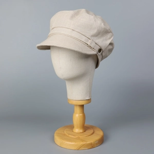 Casquette gavroche chic en lin beige clair avec bouton décoratif en bronze vintage