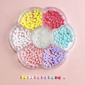 7-grid flower nail art kit with colorful bows and white pearls in pink setting
