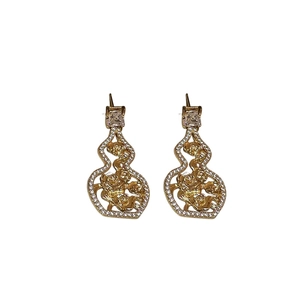 Elegant gold gourd-shaped stud earrings with sparkling cubic zirconia on white background