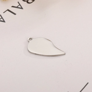 Close-up of teardrop stainless steel pendant with mirror finish and hanging hole