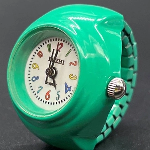 Minimalist green candy color watch ring with a white quartz dial and silicone band