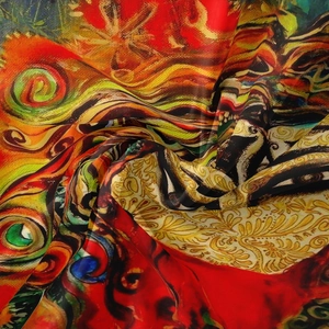 Macro shot of colorful Bohemian tapestry fabric with intricate artistic peacock patterns