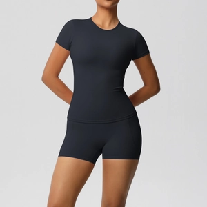 Close-up of black double-sided brushed nylon yoga set with crew neck tee and shorts