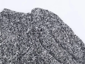 Détail du tissu en maille texturée noire et blanche avec une texture épaisse de qualité