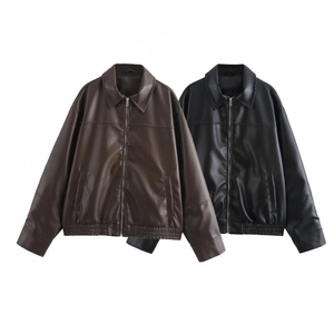 Flat lay of vintage faux leather bomber jackets with zippers in brown and black