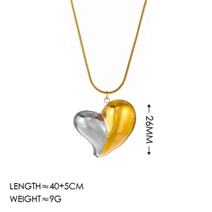 Exaggerated 18K gold and silver two-tone heart pendant necklace on white background
