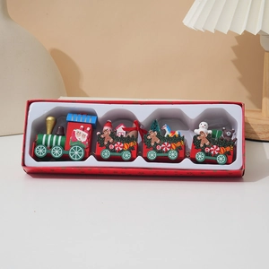 Christmas wooden train set with gingerbread man and Santa Claus in a gift box