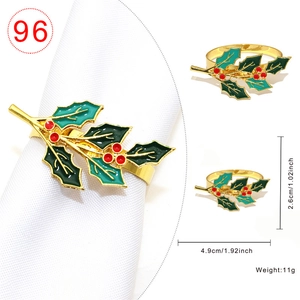 Christmas holly leaf napkin ring in golden alloy with red berries and green enamel details