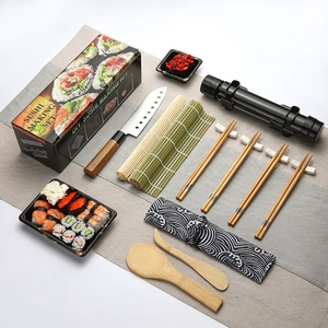 Top-down view of a complete 11-piece bamboo sushi making set with mats, knife, and chopsticks