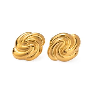 Detailed macro view of 18K gold-plated stainless steel swirl knot stud earrings