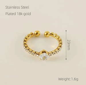 Detail of 18k gold plated stainless steel ring with square crystal and size markings