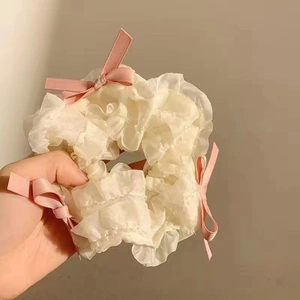 Sweet white lace scrunchie with soft pink satin ribbons and delicate bows