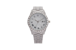 Macro shot of silver roman dial watch with sparkling crystals and calendar window