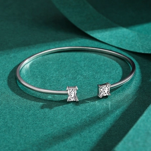 Sparkling S925 sterling silver open cuff bracelet with pavé stones on green surface