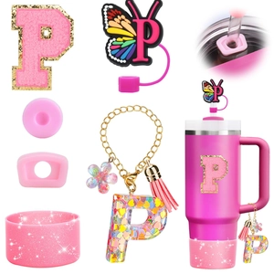 Pink Stanley cup accessory set with letter P keychain, butterfly straw cover and silicone boot