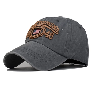 Detailed close-up of charcoal gray washed cotton baseball cap with San Francisco embroidery