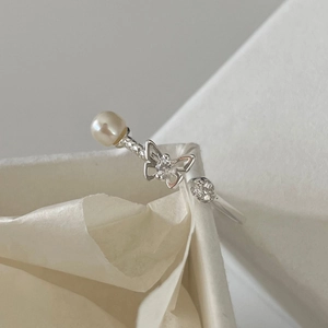 Macro detail of S925 sterling silver butterfly ring with pearl and cubic zirconia stones