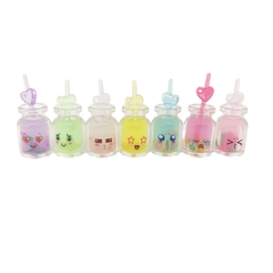 Set of seven colorful luminous resin mini bottle charms with cute cartoon emoji faces