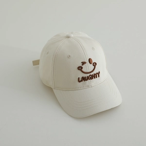 Detail of premium cotton twill beige baseball cap with brown wink smiley embroidery