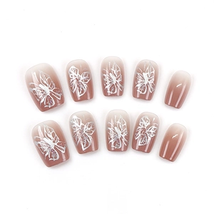 Pink gradient press-on nails with silver butterfly design and glitter accents, 10-piece set