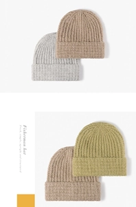 Close-up of knit texture on warm thick beanie hats in grey, khaki and olive green