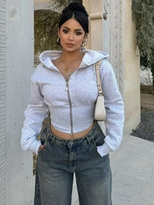 Cropped grey zip-up hoodie with corset waist and metal zipper for athletic street style