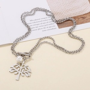 Detail view of tree of life pendant with pearl and T-bar clasp on double layer chain