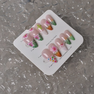 Detail of 3D embossed flowers and green cross art on 10pcs almond press-on nails