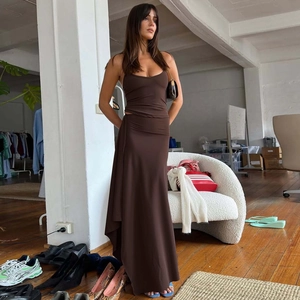 Detail of dark brown two-piece set featuring slim-fit halter top and draped maxi skirt
