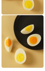 Macro shot of realistic boiled egg food model with detailed resin yolk and white slices