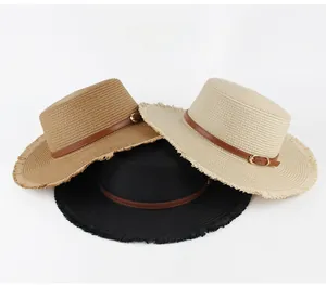 Flat top straw sun hats in brown, beige, and black with leather belts and frayed edges