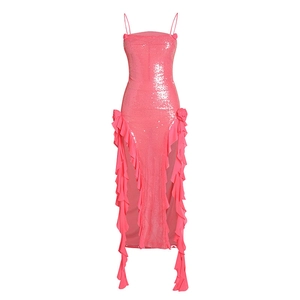 Pink sequin evening gown with ruffle trim and high slit detail on a white background