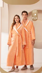 Close-up of pink thickened flannel robe with white lapel trim and waist tie design