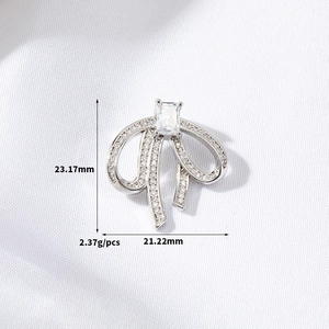 Silver bow pendant with cubic zirconia inlay, measuring 23.17mm by 21.22mm and 2.37g weight