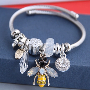 Silver bead bracelet with enamel bee, crystal flower charm on textured blue box