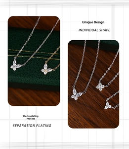 Detailed macro view of S925 sterling silver clover and butterfly pendants with cubic zirconia