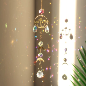 Macro detail of crystal suncatcher casting rainbow light reflections with mushroom and moon