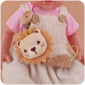 Detailed view of handmade wooden lion pacifier clip with plush details and cotton cord