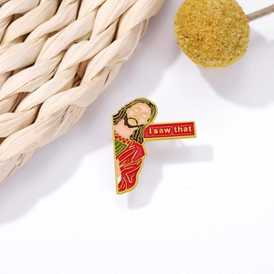 Detailed close-up of Jesus enamel pin with I Saw That sign on a natural background