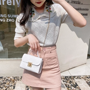 Classic white quilted crossbody bag with gold chain strap and elegant metal clasp