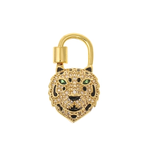 Exquisite gold tiger head pendant with sparkling crystals and green gem eyes on white background