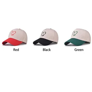 Three cotton baseball caps with contrast brims and heart footprint embroidery