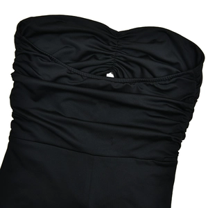 Detail of black strapless bodysuit featuring bust ruching and a small central cutout