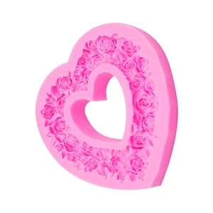Pink heart-shaped silicone mold with rose flower relief for baking and DIY crafts