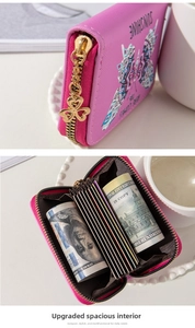 Detail of rose pink mini wallet with butterfly embossing and accordion card slots