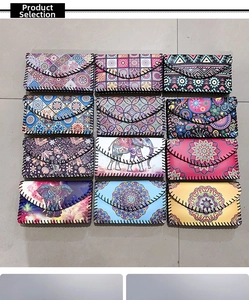 Detailed grid of twelve ethnic crossbody bags with colorful mandala and elephant prints